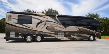2006 Elegant Lady 7187-B exterior entry side view of motorcoach on the lot