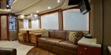 2006 Elegant Lady 7187-B motorcoach interior view of side-table and sleeper sofa couch