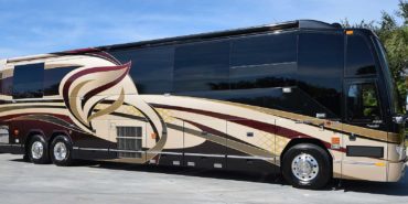 2010 Liberty Coach #M7184 exterior entry side front view of motorcoach on the lot