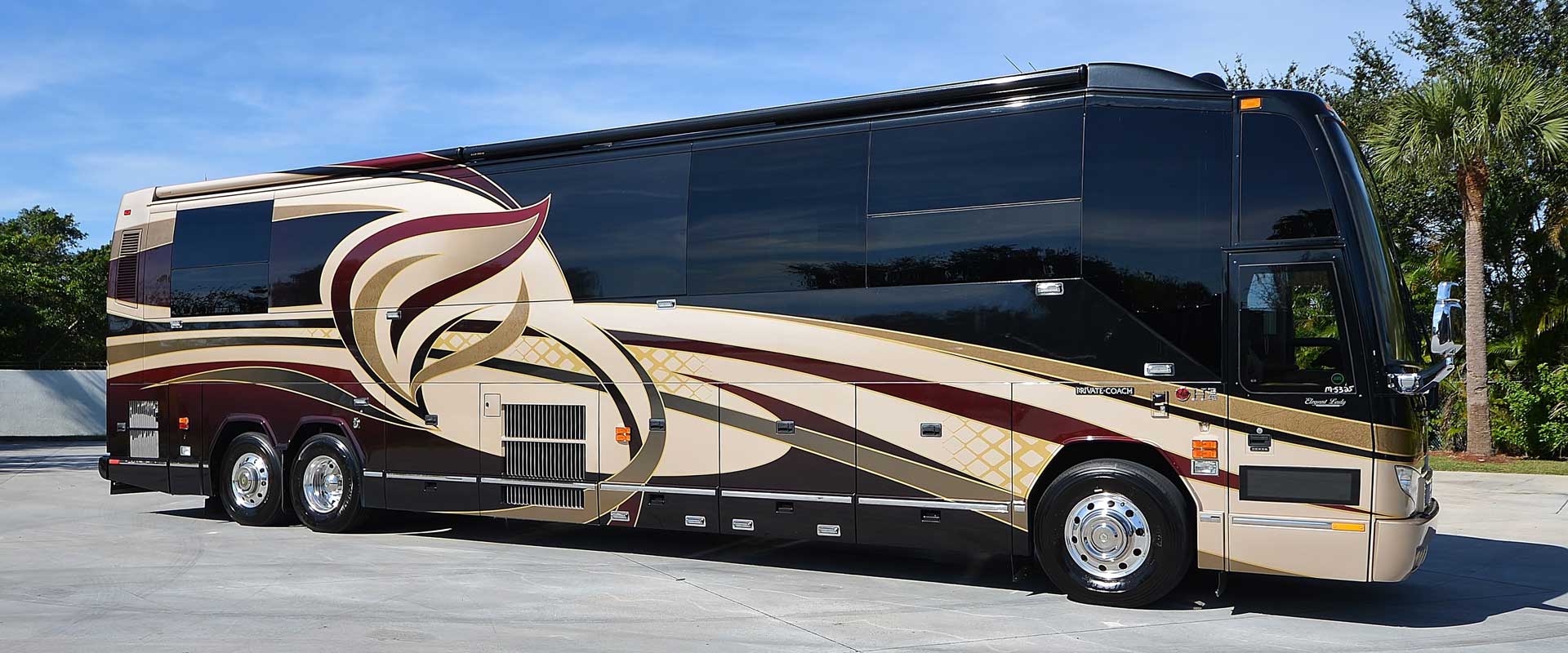 2010 Liberty Coach #M7184 exterior entry side front view of motorcoach on the lot