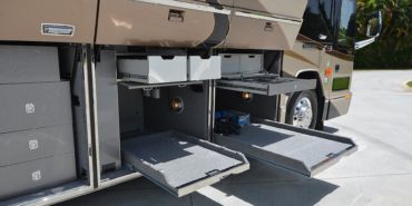 2012 Elegant Lady #7182 exterior entry side undercarriage bays of motorcoach