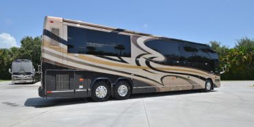 2012 Elegant Lady #7182 exterior entry side rear view of motorcoach on the lot