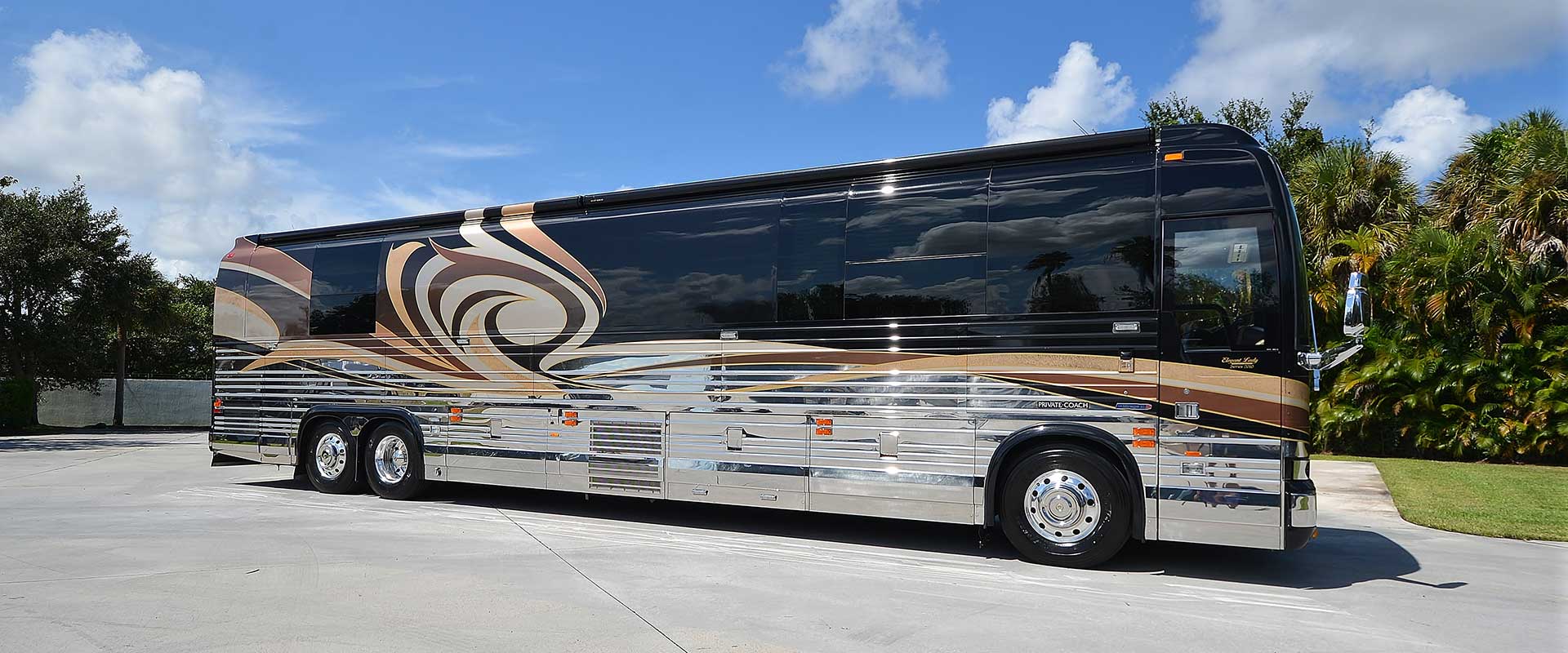 2010 Liberty Coach #882-B exterior entry side front view of motorcoach on the lot