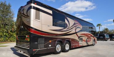 2011 Liberty Coach #5403-A exterior entry side rear view of motorcoach on the lot