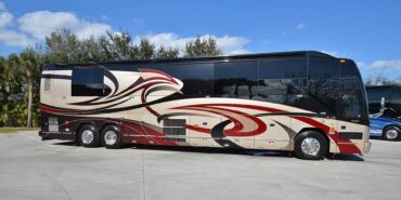 2011 Liberty Coach #5403-A exterior entry side view of motorcoach on the lot