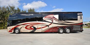 2011 Liberty Coach #5403-A exterior driver side view of motorcoach on the lot
