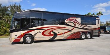 2011 Liberty Coach #5403-A exterior driver side front view of motorcoach on the lot