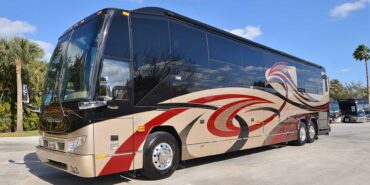 2011 Liberty Coach #5403-A exterior driver side front view of motorcoach on the lot