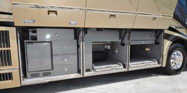 2012 Liberty Coach #5404 exterior entry storage view of motorcoach on the lot