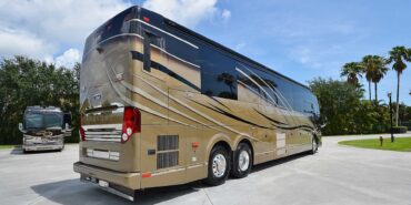 2012 Liberty Coach #5404 exterior entry side rear view of motorcoach on the lot