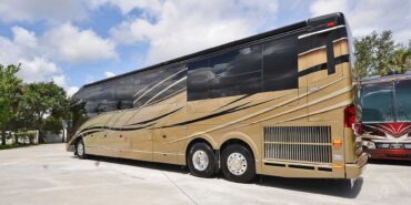 2012 Liberty Coach #5404 exterior driver rear view of motorcoach on the lot