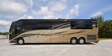 2012 Liberty Coach #5404 exterior driver side view of motorcoach on the lot
