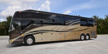 2012 Liberty Coach #5404 exterior driver side front view of motorcoach on the lot