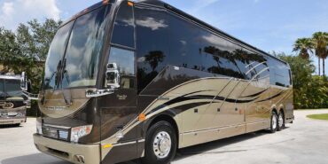 2012 Liberty Coach #5404 exterior driver side front view of motorcoach on the lot
