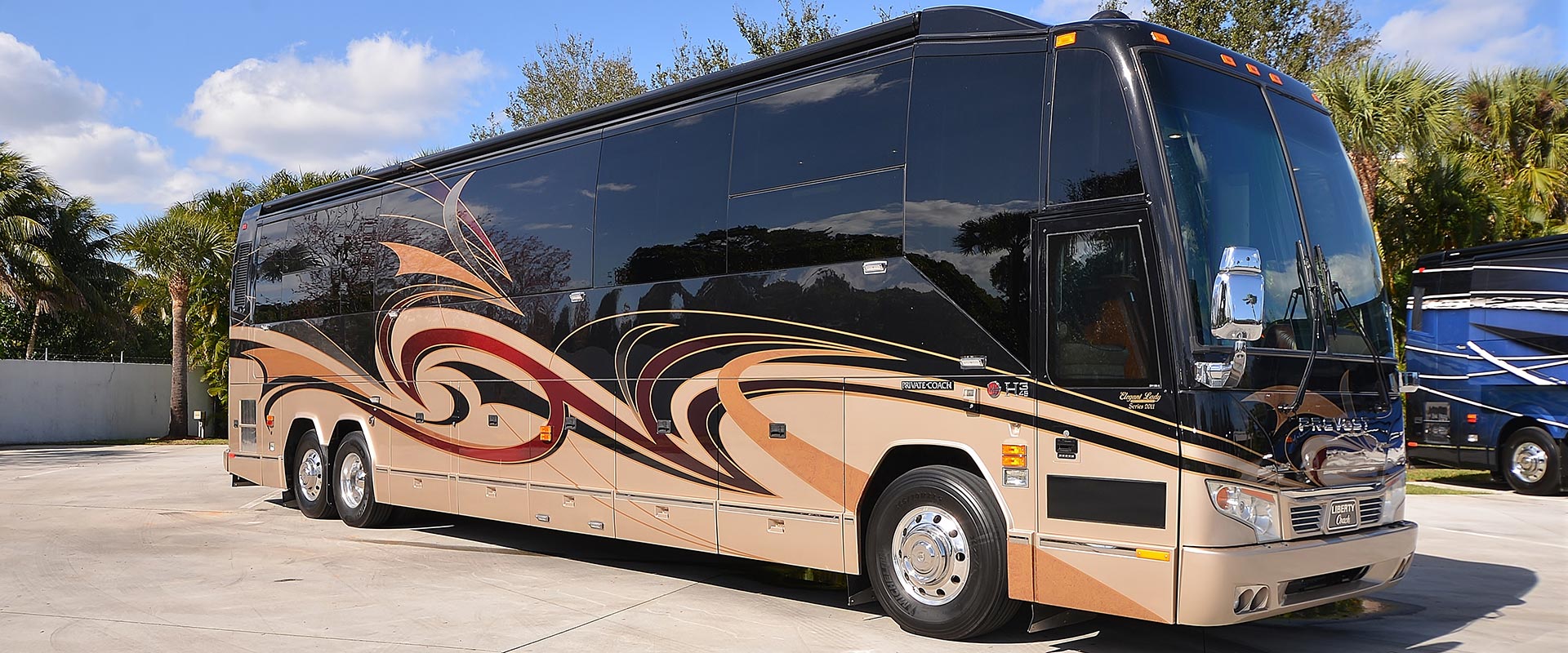 2011 Liberty Coach #836-B exterior entry side front view of motorcoach on the lot