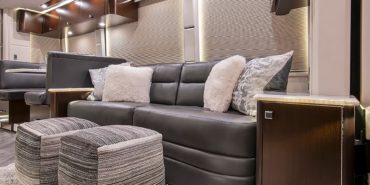 2021 Emerald #M5375 coach interior look back view of table and couch