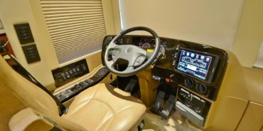 2017 Emerald #M5378 motorcoach interior cockpit with driver seat and dashboard area