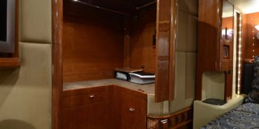 2007 Liberty Coach #M5388 motorcoach interior view of bedroom shelving wall unit