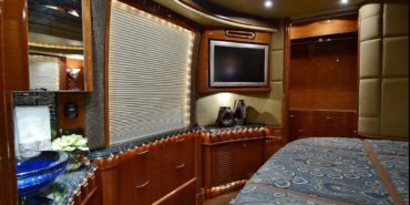 2007 Liberty Coach #M5388 motorcoach interior view of bedroom shelving wall unit with TV
