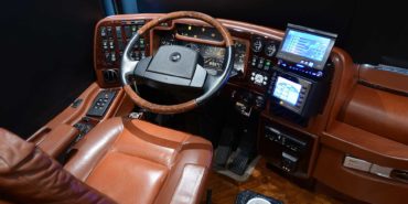 2007 Liberty Coach #M5388 motorcoach interior cockpit with driver seat and dashboard area