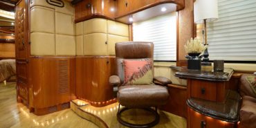2008 Liberty Coach #M7199 motorcoach interior view of side chairs and table
