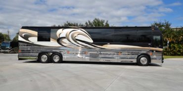 2008 Liberty Coach #M7199 exterior entry side view of motorcoach on the lot