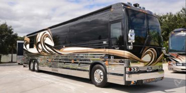 2008 Liberty Coach #M7199 exterior entry side front view of motorcoach on the lot