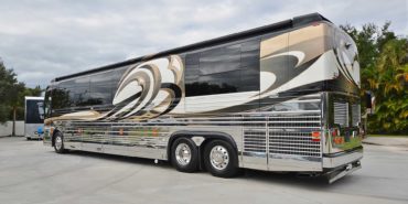 2008 Liberty Coach #M7199 exterior driver side view of motorcoach on the lot