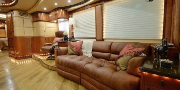 2008 Liberty Coach #M7199 motorcoach interior view of side-table and sleeper sofa couch