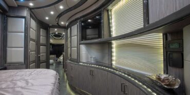 2014 Liberty Coach motorcoach interior view of bedroom shelving wall unit with TV