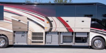 2014 Liberty Coach exterior driver side front view of motorcoach on the lot