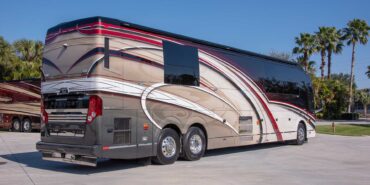 2014 Liberty Coach exterior entry side rear view of motorcoach on the lot