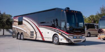 2014 Liberty Coach exterior entry side front view of motorcoach on the lot