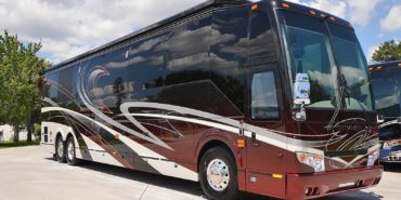 2019 Millenium #M5377 exterior entry side front view of motorcoach on the lot