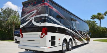 2019 Millenium #M5377 exterior entry side rear view of motorcoach on the lot