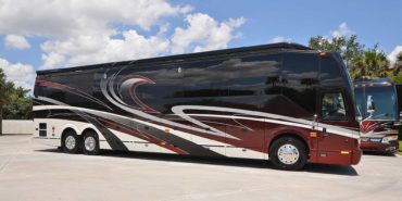 2019 Millenium #M5377 exterior entry side view of motorcoach on the lot