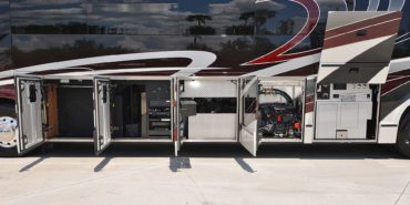 2019 Millenium #M5377 exterior driver side undercarriage open mechanical and storage bays of motorcoach