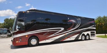 2019 Millenium #M5377 exterior driver side view of motorcoach on the lot with slides out