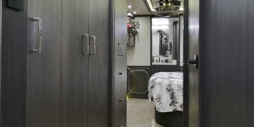 2019 Millenium #M5377 motorcoach interior view of hallway leading to bedroom