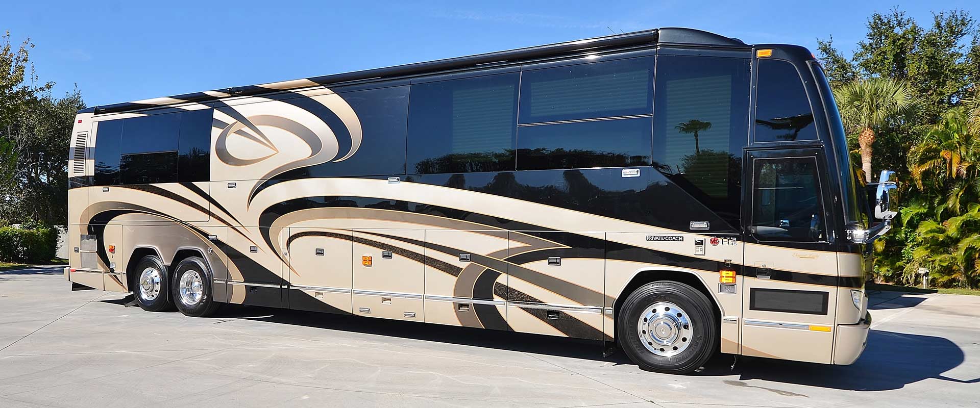 2011 Liberty Coach #M7185 exterior entry side front view of motorcoach on the lot