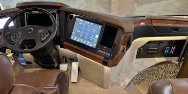 2022 Newell P50 #5391 motorcoach interior cockpit with driver seat and dashboard area