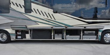 2022 Newell P50 #5391 exterior entry side undercarriage storage bays with pull out drawers of motorcoach