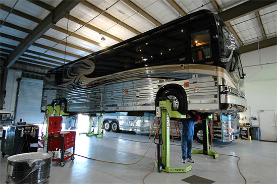 Motorcoach on lift in Liberty Coach of Florida service bay